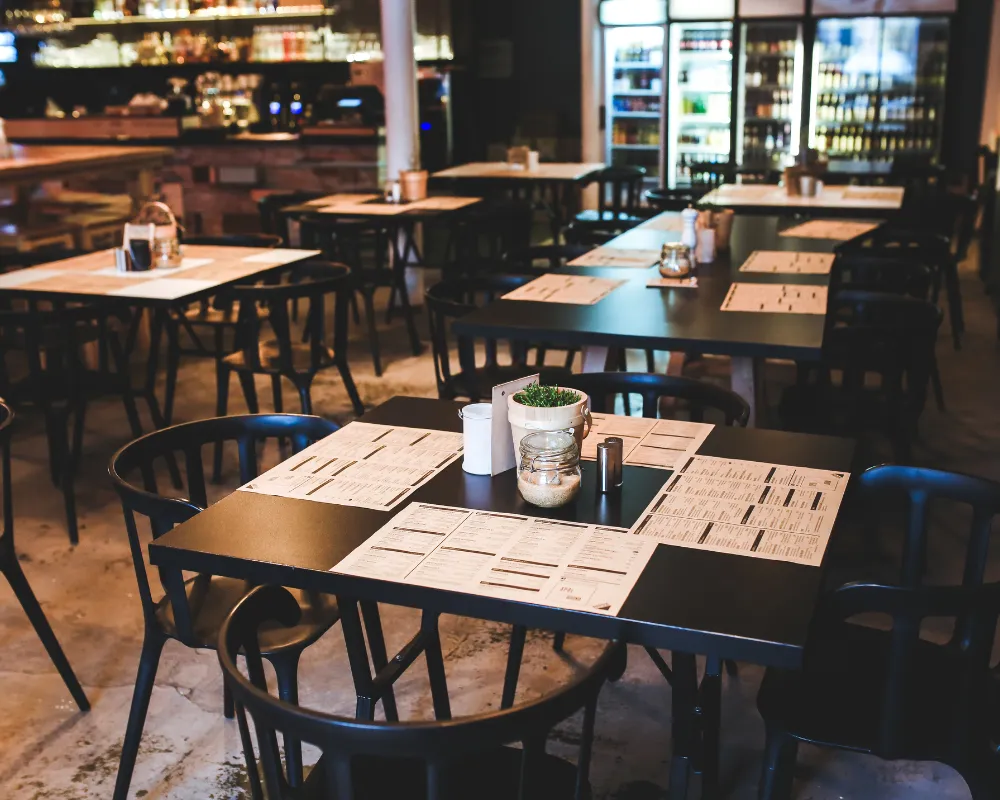 Empty restaurant with tables and chairs.